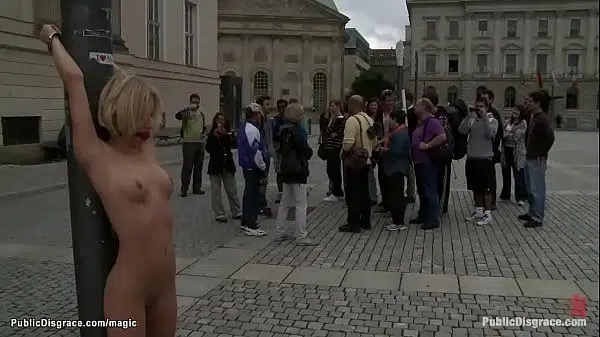 Blonde European hottie Paris Pink is gagged and bound to metal pole in public for onlookers then in stairs fucked by big cock master Tommy