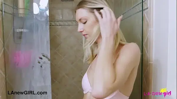 Striking blonde beauty enjoys a sensual bath