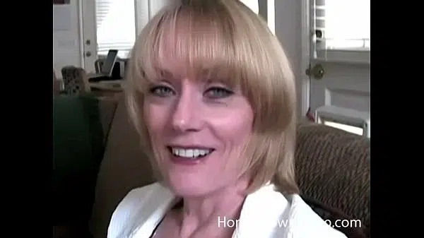 Older busty blonde sucking cock