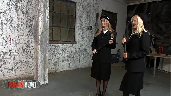 Under their austere uniform these 2 pretty blondes wear stockings and corsets